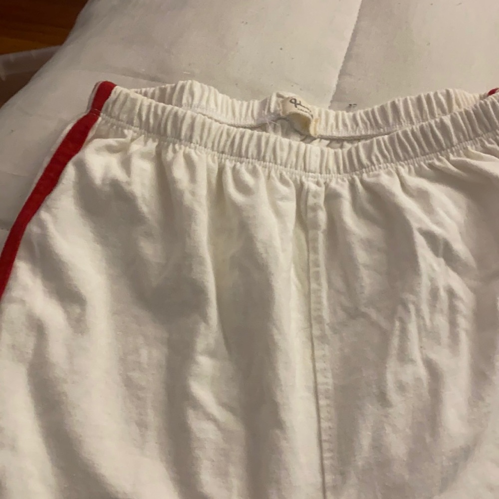 White sweats with red stripes